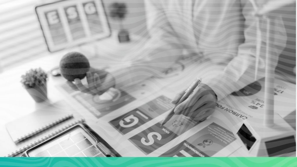 A compliance officer uses a calculator and paperwork to prepare a SEBI BRSR report, resolving data accuracy issues with ESG software India.