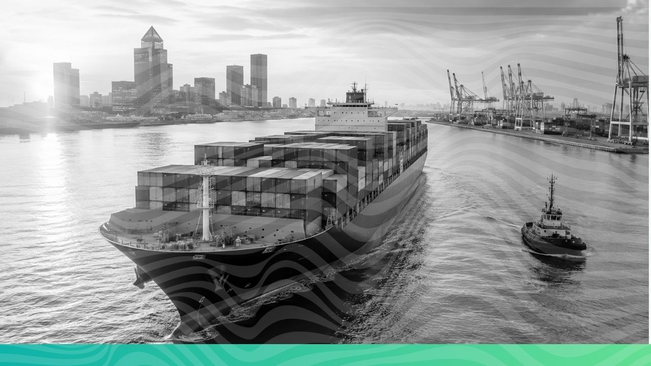 A large container cargo ship navigating green ocean waters near a port representing UK CBAM and global carbon trade compliance.